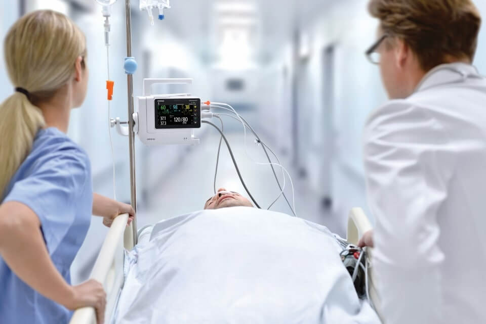 anesthesiologist monitoring patient under anesthesia